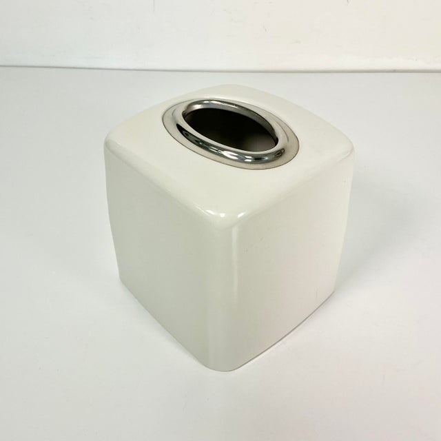 This is a modern contemporary enameled white Tissue Box Cover that has a silver oval opening at the top. Great Box Cover...