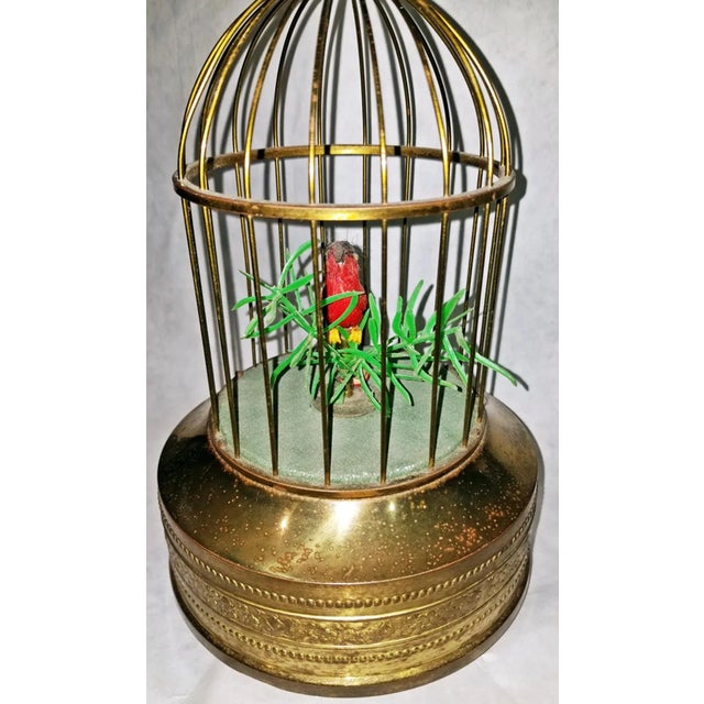 Sweet singing cardinal in this solid brass vintage music box automaton, tweets and wags tail feathers. Circa 1950=60s, no...