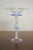 A delicate vintage Venetian Murano-style art glass compote featuring a ribbed flared bowl, applied cobalt-blue ruffled...