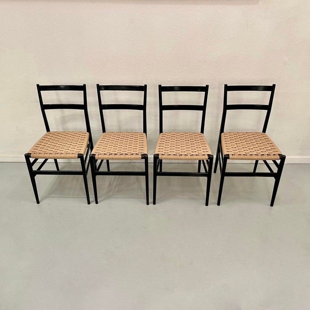 Set of four Leggera chairs by Gio Ponti, produced by Cassina in Italy around 1955. Black wood and rope. Manufacturer's...