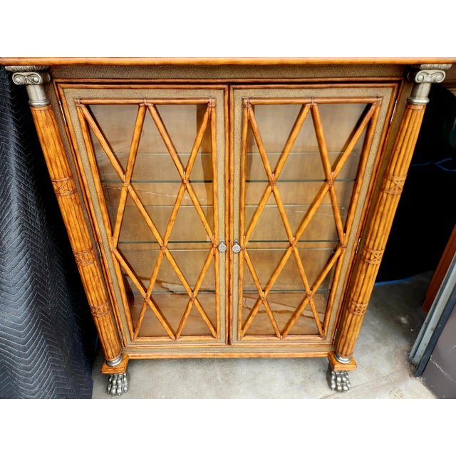 Tremendous empire-style display or curio cabinet with large rattan columns, and beautiful glass doors....this large...