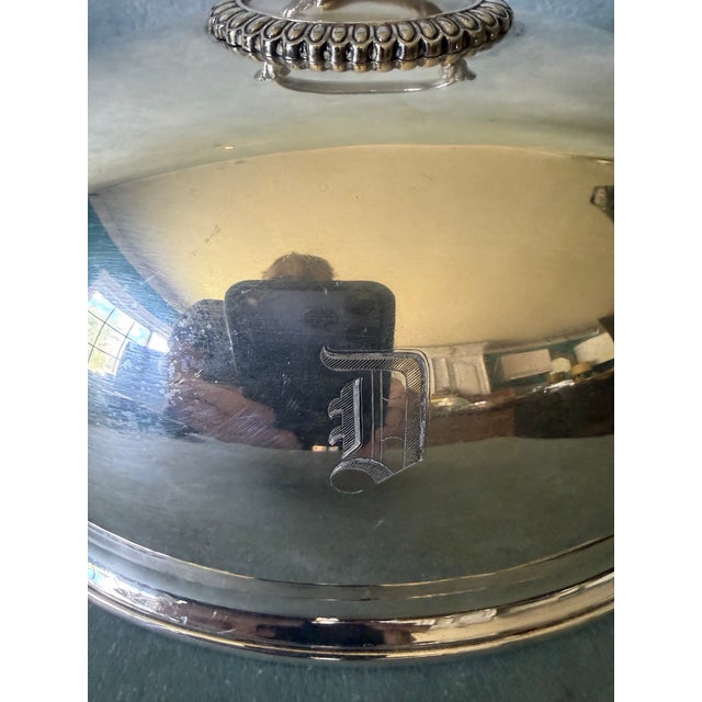 Antique silverplate domed cloche with an engraved letter D.
