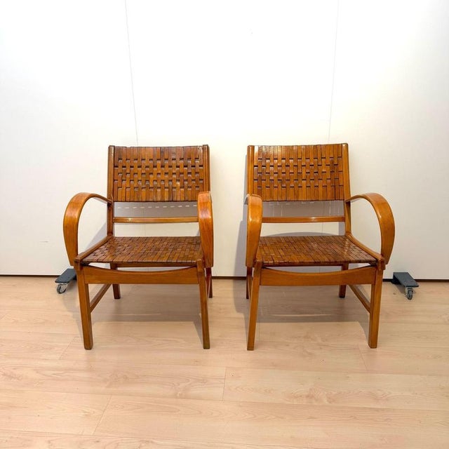 Set of two Bauhaus / Mid-Century chairs with bent armrests by Gelenka from Germany, circa 1950. Curved beech wood...