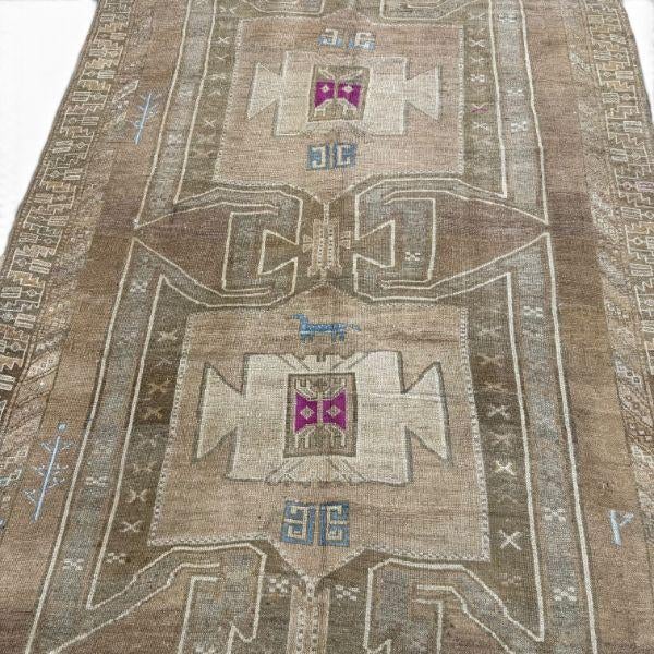 This vintage Turkish Kars rug showcases the distinctive large medallions characteristic of traditional Kars designs. The...