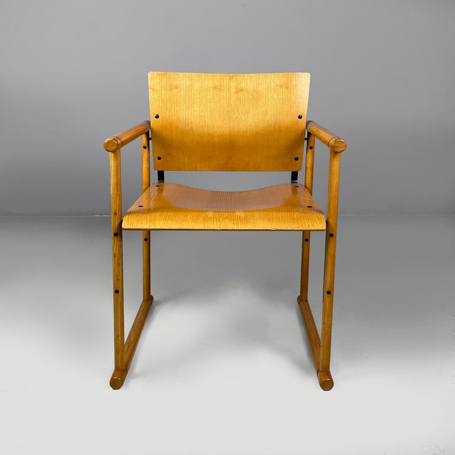 Italian modern chairs with armrests in wood and black metal, 1970s Pair of chairs with square seats and backrests in light...
