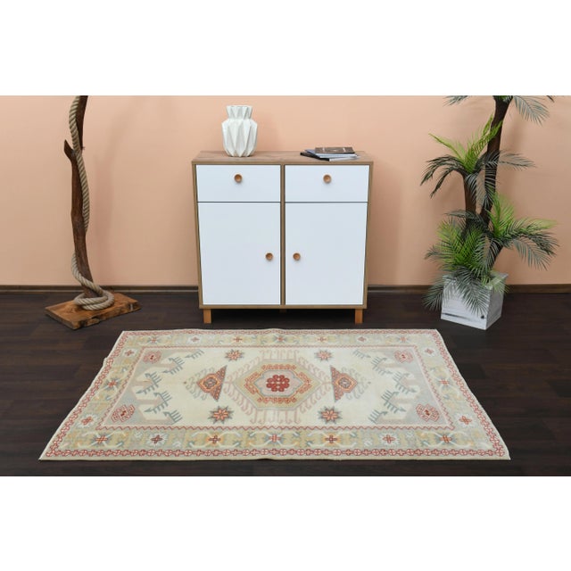 Vintage Turkish Hand-Knotted vintage rug is a semi-antique vintage area rug.'70s Eastern region of Turkey's unique rug is...