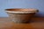 This large glazed earthenware bowl was once used for kneading and proofing bread dough. A rustic piece with a rich and...