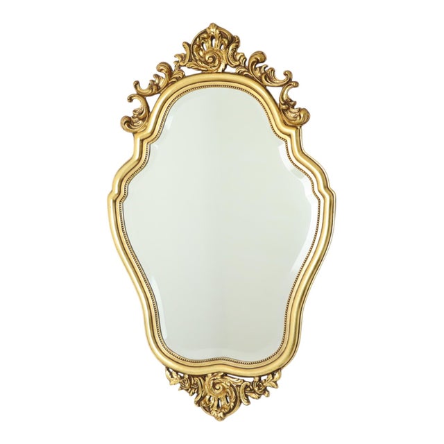 Classic French mirror, crested mirror gilded with gold leaf, entirely in Baroque style. This mirror features a beautiful...
