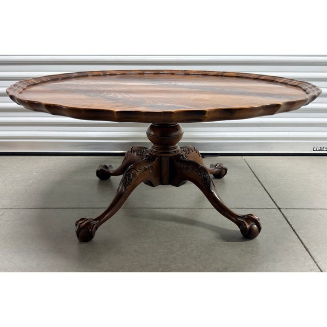 Elevate your living space with this exquisite Henredon Piecrust Coffee Table! This stunning piece showcases the timeless...