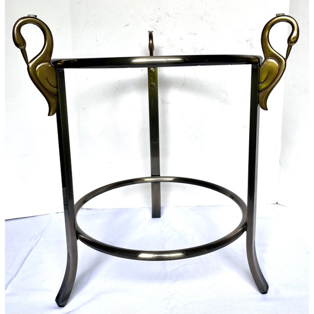 Hollywood regency style accent table by the Design Institute of America. Brushed steel frame with curved legs accented...