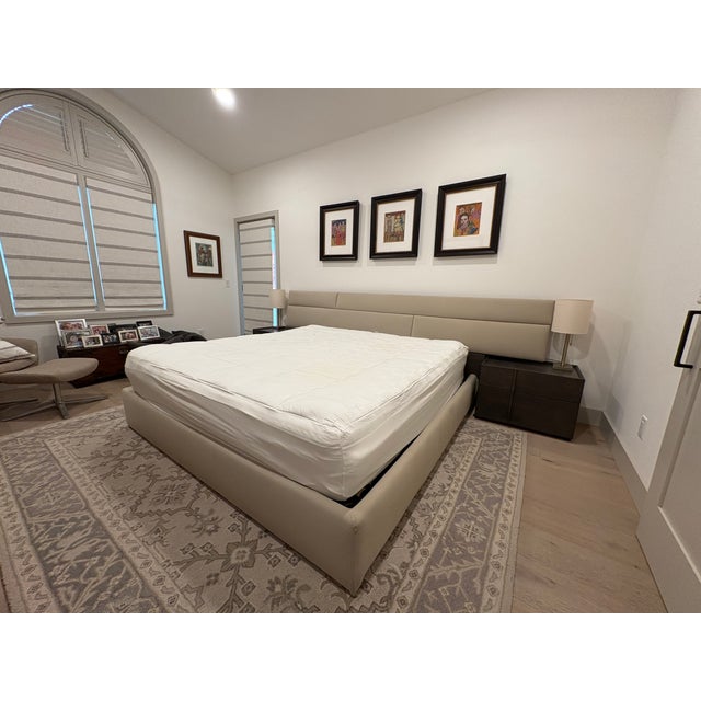Contemporary Huppé Plank bedroom set designed by Joel Dupras. Features padded and upholstered headboard, railings and...