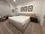 Contemporary Huppé Plank bedroom set designed by Joel Dupras. Features padded and upholstered headboard, railings and...