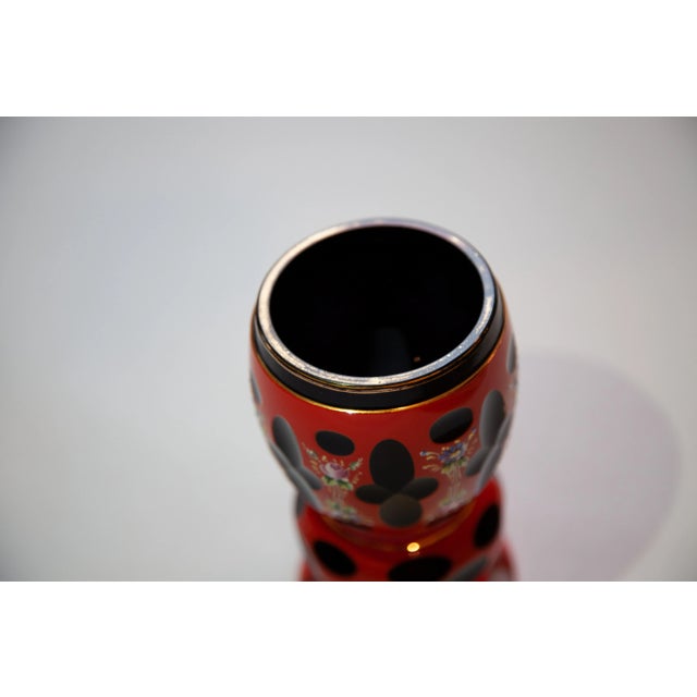 Bohemian Overlay Beaker. Orange-Red over clear and amethyst with facet cuts to clear. Floral enamel and gilt decoration....