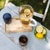 Collection for the table in clear colored glass. It includes tumblers for water and soft drinks, wine glasses, flute...