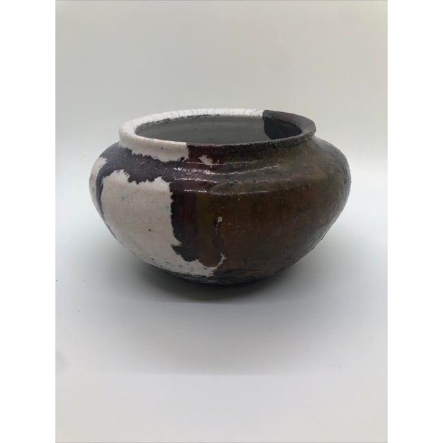 A lovely signed pottery piece of varied textures and colors