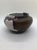 A lovely signed pottery piece of varied textures and colors