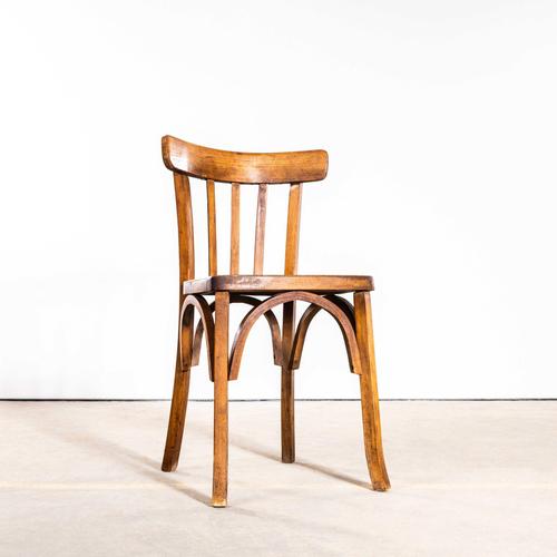 1950’s Warm Oak French Baumann Bentwood Bistro Dining Chairs. Made by the maker Baumann. Baumann is a slightly off the...