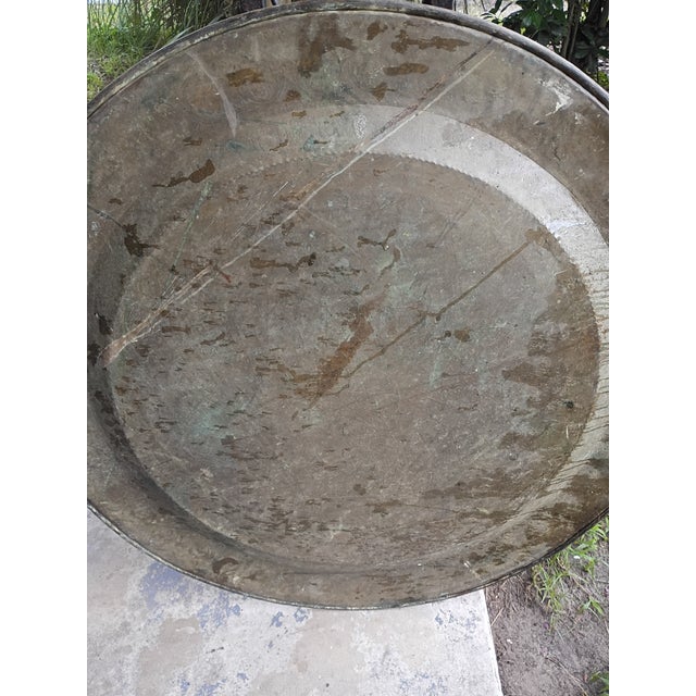 A museum-quality, monumental 36-inch late 19th-century Moroccan (Moorish) hand-chased copper tray tabletop. This...