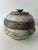 Vintage studio pottery vessel with lid. Beautiful handmade piece with blue, brown, burnt sienna and white glazes. Glaze is...