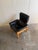 Beautiful vintage Swedish lounge armchair by Göte Möbler, featuring supple black leather upholstery paired with a solid...