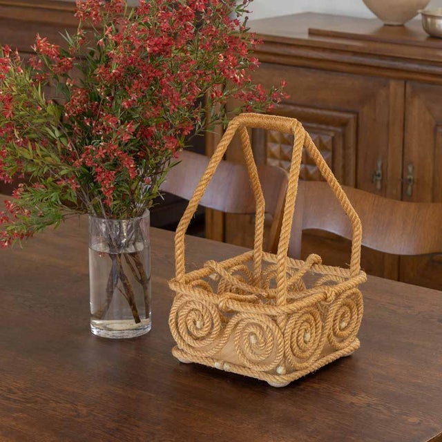 Beautiful rope bottle holder with four compartments and carrying handle by Audoux Minet, France circa 1950. Rope wrapped...