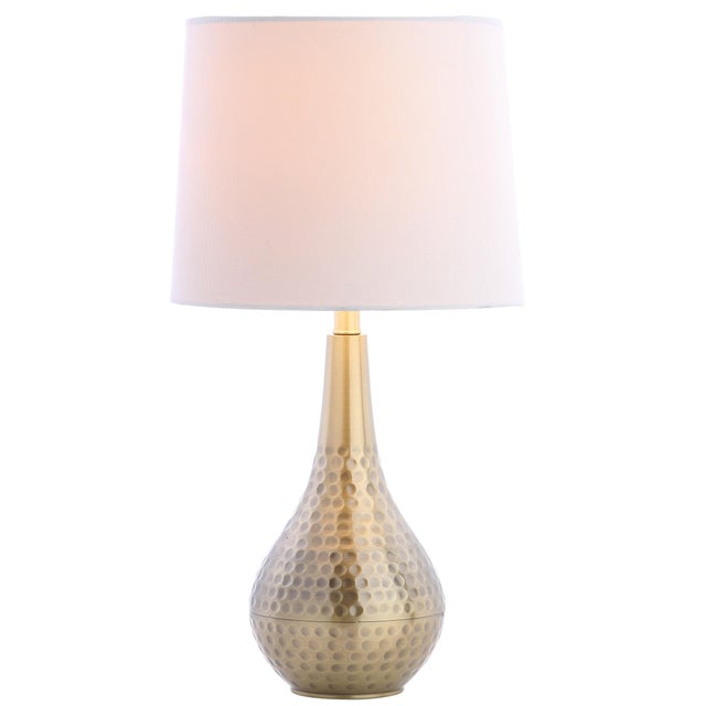 A luxurious addition to any living room, this contemporary table lamp is a classic. Crafted with a radiant plated gold...