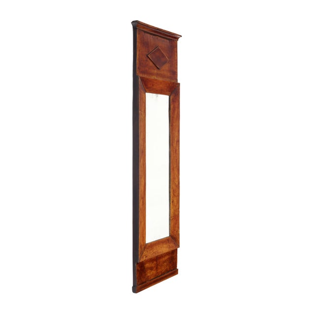 Mirror from the Directoire period made of solid walnut with a central rectangular mirror. This piece is in very nice...