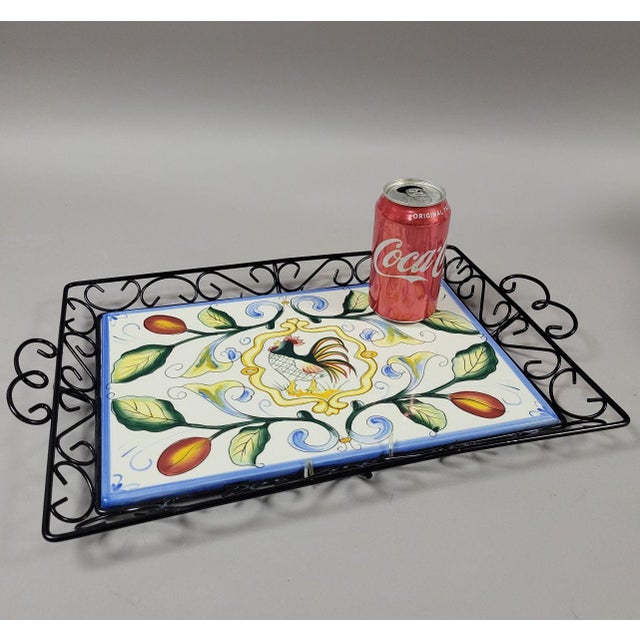 a colorful Fitz & Floyd hand painted rooster tile secured in black metal tray with handles. This tray was used...