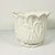 This is a gorgeous 1974 large ceramic planter from USA Whittier Pottery. The design is a white Tulip bloom in the Trompe...