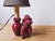 A poodle-shaped lamp? Absolutely! Made in France in the 1950s, it's made of glazed ceramic in a deep burgundy red. The...