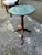 Vintage Bombay Company Green Marble Plant Stand. It features circular green marble top on a turned mahogany pedestal stand...