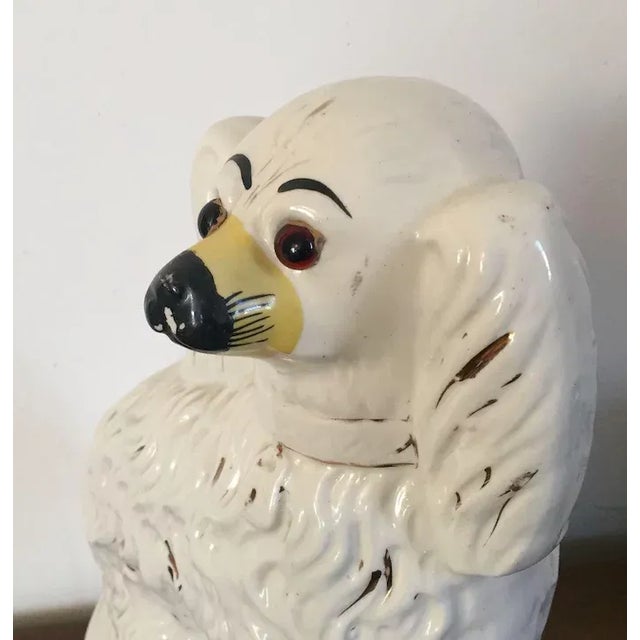 Large antique 19th century English Victorian staffordshire pearlware dog figure with glass eyes. Measures 12 1/2" tall x...