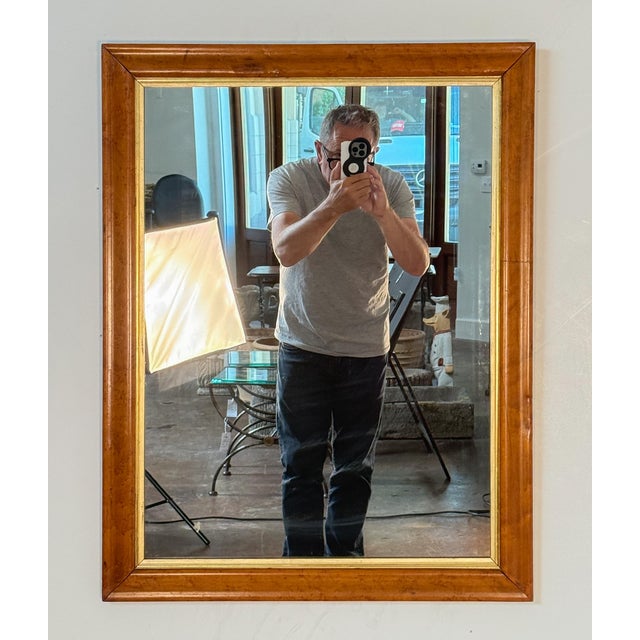 A fine English rectangular mirror featuring a curly maple frame with a giltwood 'slip' around the inner moulding. Ready...