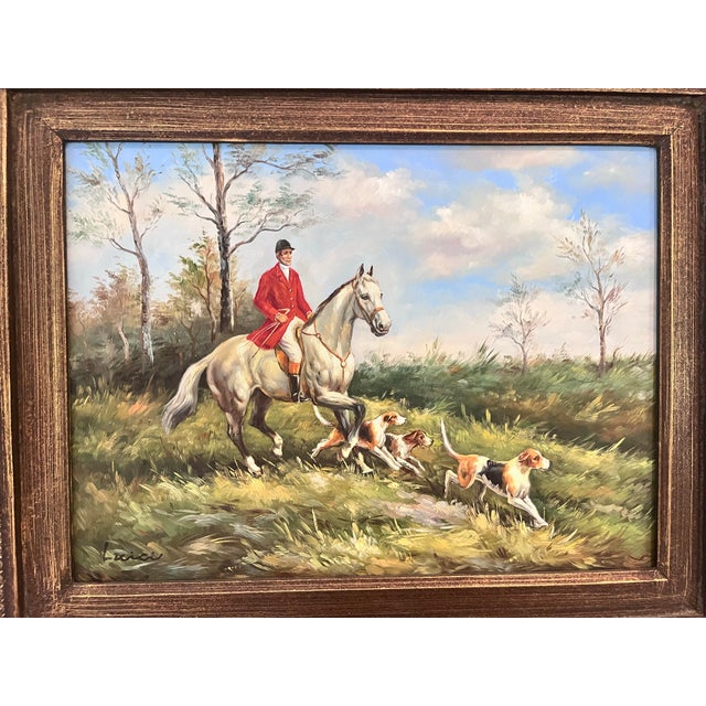 A charming vintage oil painting depicting a classic fox hunt scene, featuring a mounted rider in traditional red hunt...