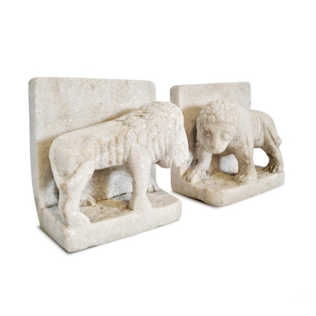 Pair of vintage hand chiseled white solid marble sitting lion bookends or doorstops. Each slightly unique in natural...
