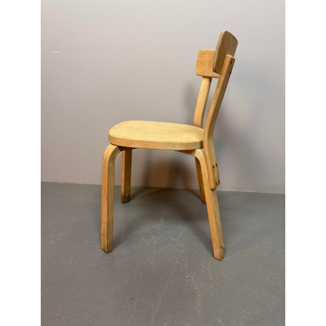 Authentic set of four first-edition Alvar Aalto Model 69 dining chairs with nice patina, produced by Artek Finland....