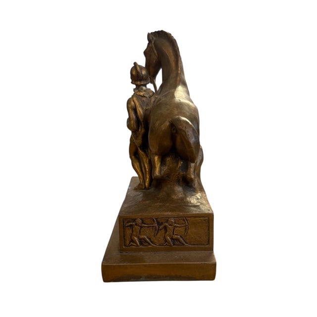 This finely detailed bronze bookend by Jennings Brothers showcases a commanding scene of a warrior and his horse, rendered...