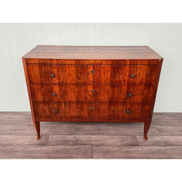 Antique 19th-century walnut veneered chest of drawers in Biedermeier style. Some parts were added or replaced during a...