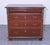 This antique pine chest of drawers features a rich, warm finish with elegant brass hardware. Its classic design is...