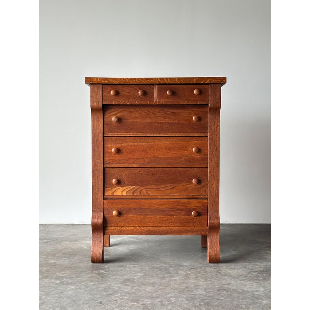 This antique chest lets the wood do the talking — richly figured quartersawn oak with prominent ray-fleck figuring...