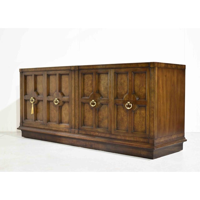 A handsome statement in richly figured burl wood, this vintage Mastercraft credenza embodies the drama and polish of...
