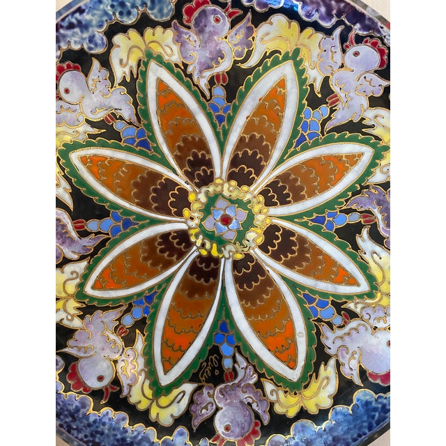 A stunning midcentury enameled glass dish by José Cire Royo. The dish is signed "Cire" in gold and features a floral motif...