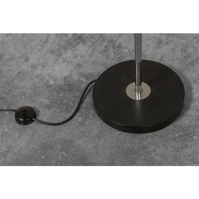 - Black and chromed floor lamp with three adjustable spotlights - Produced by Wilko in the 1970s - Spotlights can be...