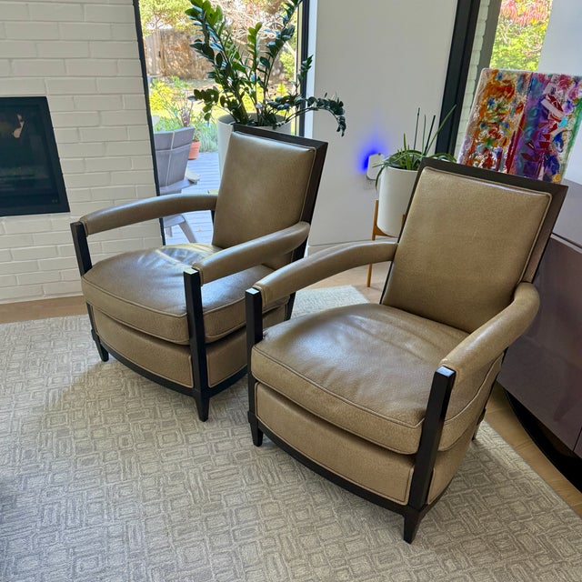 Pair Donghia Open Arm Lounge Chairs Embossed tan leather covers the sturdy architectural frames of these open arm...