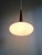 Scandinavian teak and white satin opaline pendant light, designed by louis kalff for philips in the 1960s. the pendant has...