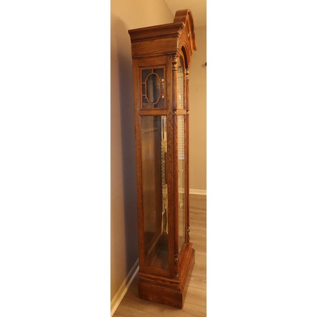This substantial American floor clock was produced by Howard Miller and represents the company’s higher-grade traditional...