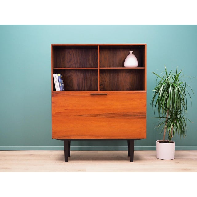 The bookcase was made in the 1970s. It was designed by leading Danish designer Ib Kofod-Larsen for Faarup Møbelfabrik. The...