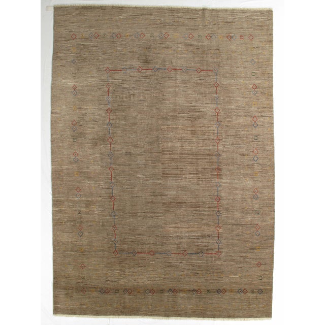 Vintage hand-knotted Persian Fine Lori Gabbeh rug featuring a soft, textured field with a delicate inner and outer border...