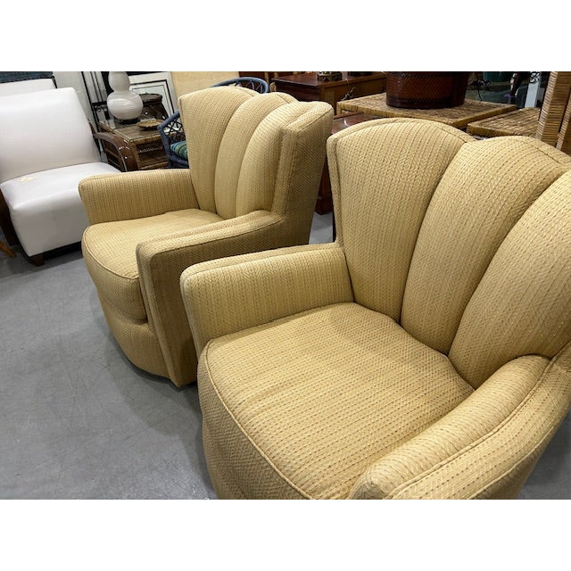 Chic pair of channel back scalloped swivel chairs ready to use as found or upholster in your favorite fabric. Nice...