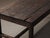 Simple and sturdy farmhouse table in solid pine, with a plank top and four straight legs joined by low stretchers. The...